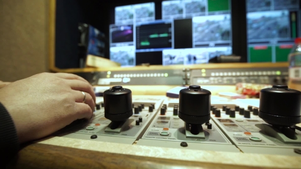 The Operator's Hand On The Console Of Television Mobile Station