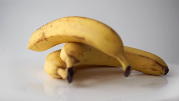 Yellow Bananas Rotation On White Background