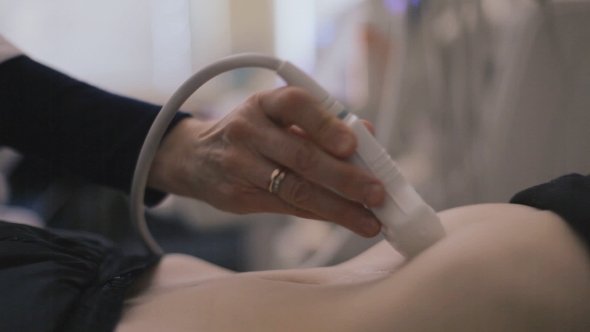 Medical Doctor Making Ultrasound With Modern Equipment
