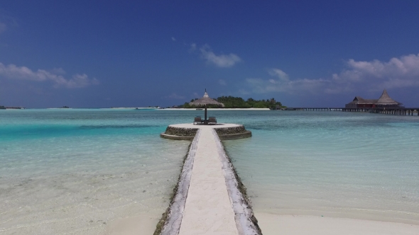 Palapa And Sunbeds On Maldives Beach Pier Over Sea