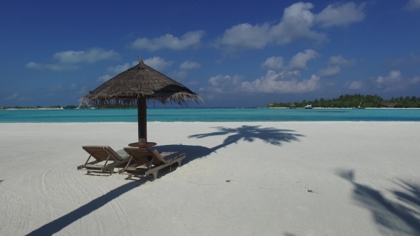 Palapa And Sunbeds By Sea On Maldives Beach 10