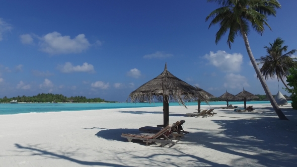 Palapa And Sunbeds By Sea On Maldives Beach 7