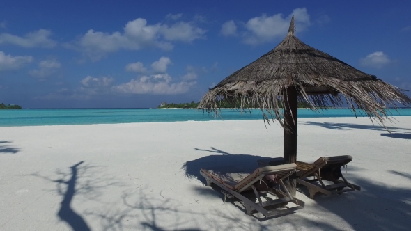 Palapa And Sunbeds By Sea On Maldives Beach 8