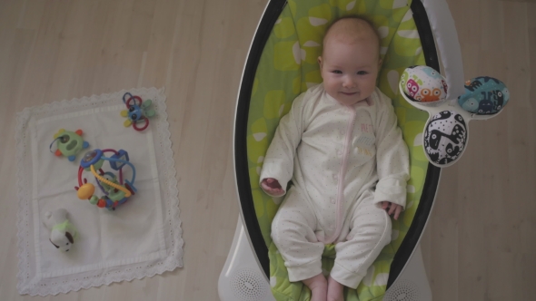 Happy Little Cute Baby Girl Swing In Electric Chair Bouncer  Top View alt