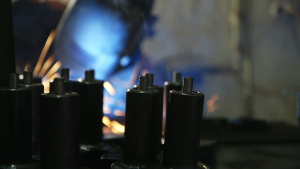 Hard Labour. Electric Welder At Work.