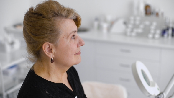 The Doctor Gives The Diagnosis. Portrait Of Smiling Senior Woman In Doctor's Office