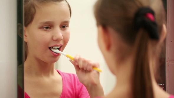 Beautiful Girl Brushing Her Teeth 
