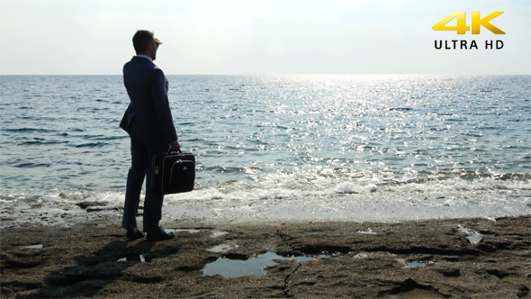 Business Man Waiting At The Seaside