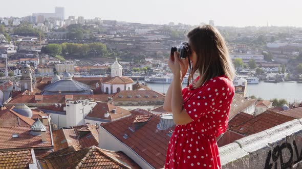 Young Woman Is Taking Photo of Panoramic View on Porto, Portugal