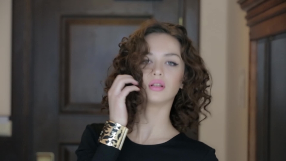 Curly Brunette Posing On Camera