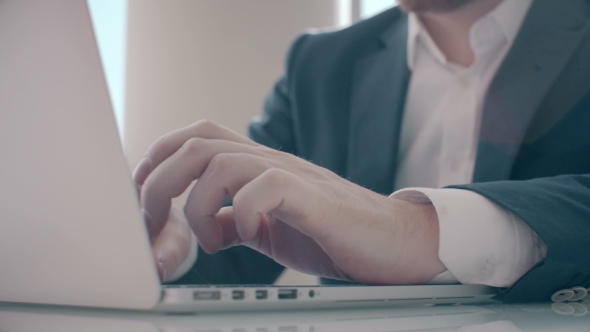 Businessman Working On Laptop Computer In The Office