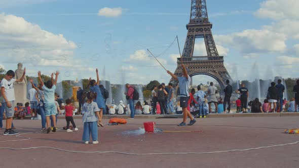Tourists on the square at the Eiffel Tower