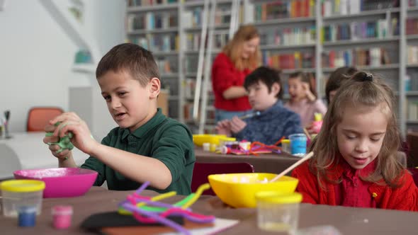 Little Boy and Girl with Disabilities in Class