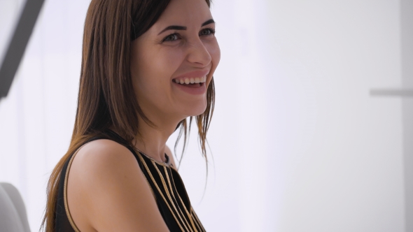 Beautiful Happy Woman Indoors Laughing