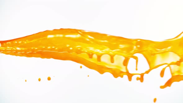 Super Slow Motion Shot of Orange Juice Spiral Splash Isolated on White Background at 1000Fps