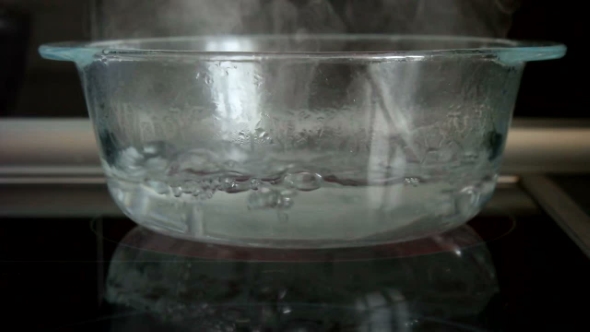 Water Boiling In Glass Bowl