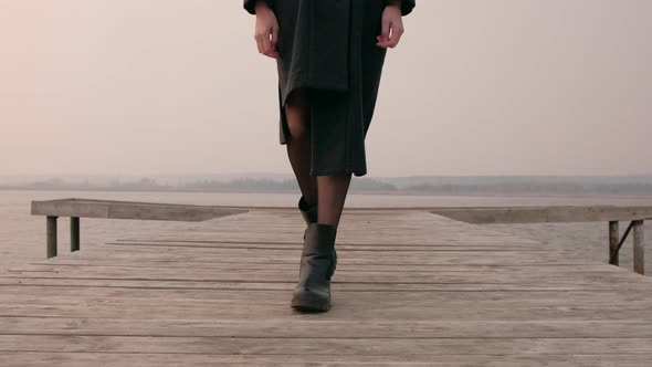 Woman on Pier at Lake