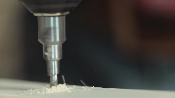 Drilling Wood With Flying Shavings 