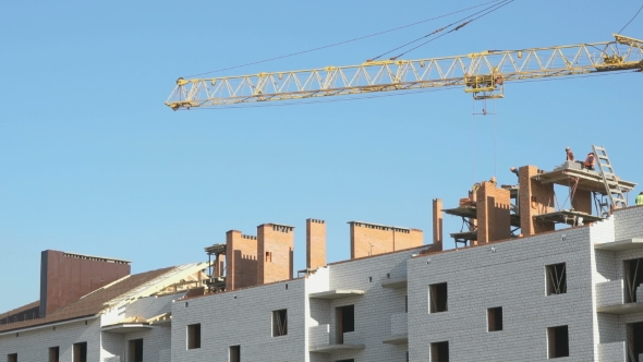 Construction Crane Working On a Luxury Object