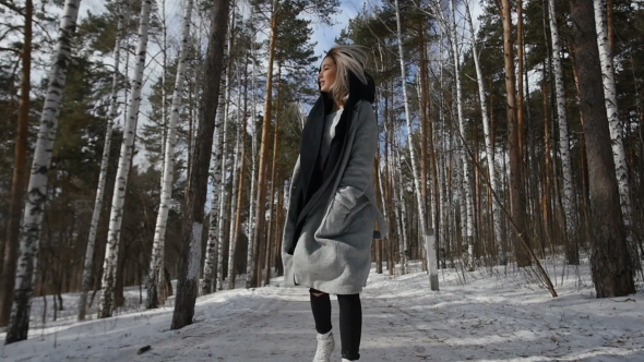 Girl Walking In Winter Forest