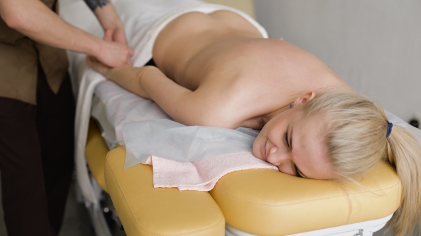 Young, Beautiful And Healthy Woman Getting Alternative Massage Treatment  alt