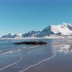 Flkastad beach under the snow during winter, with snow and mountains in the background - VideoHive Item for Sale