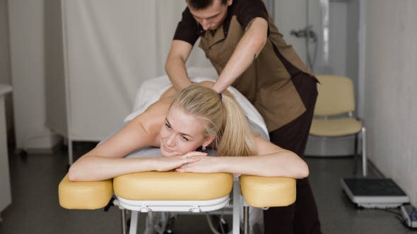 Young Attractive Blonde Woman Smiling With a Massage