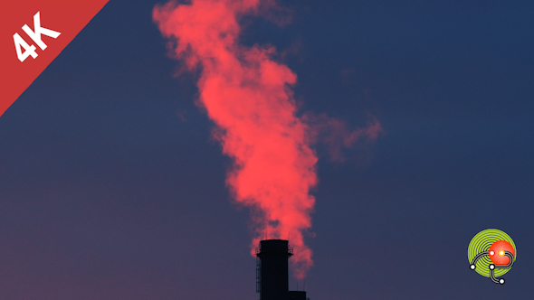 Chimneys Of Power Plant At Sunset