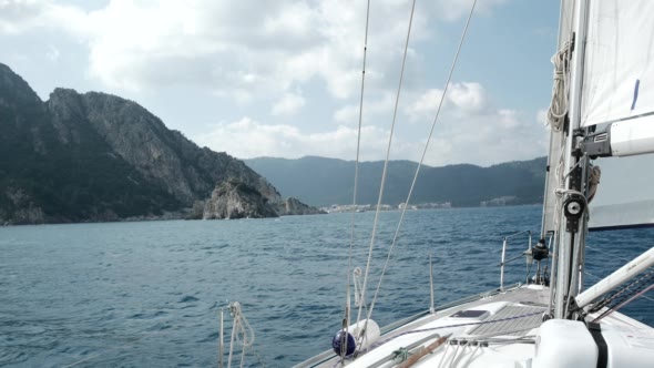 View to the Yacht Bow of a Sailboat With Sails.