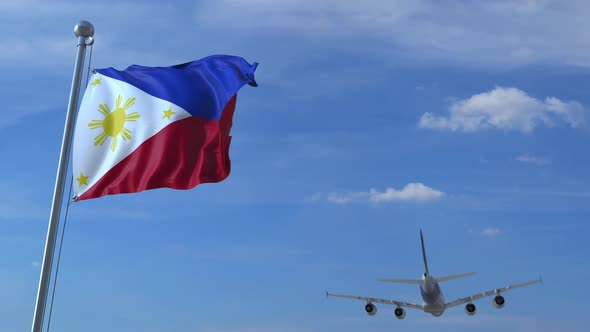 Commercial Airplane Landing Behind Waving Flag of the Philippines