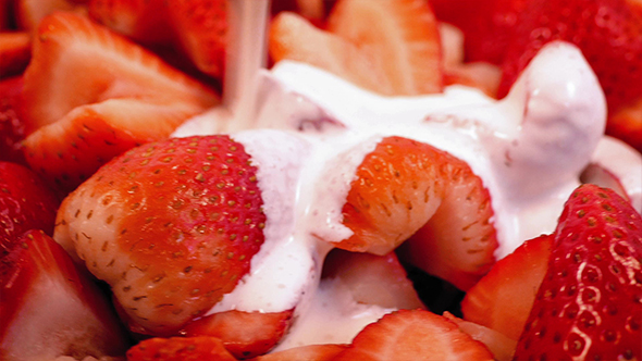 Cream Pours On Strawberry Dessert