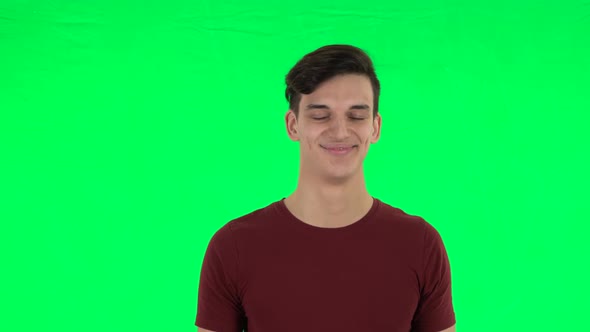 Guy Smiling While Looking at Camera. Green Screen