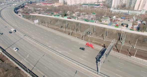 An Aerial View Of Commuters In Cars As They Drive Down The Busy Street