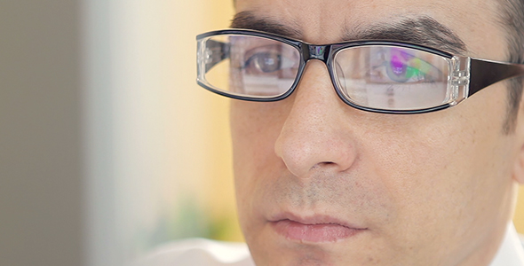 Businessman with Glasses Working on Computer 2