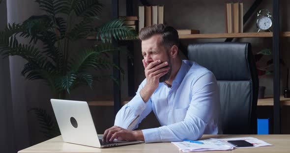 Tired Worker Overworked On Computer