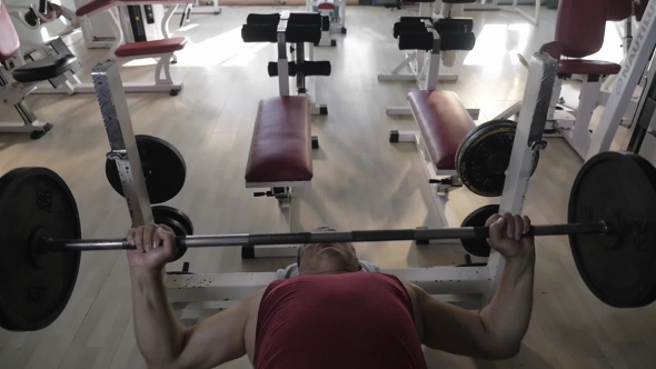 Mature Man Doing Chest Press Exercise