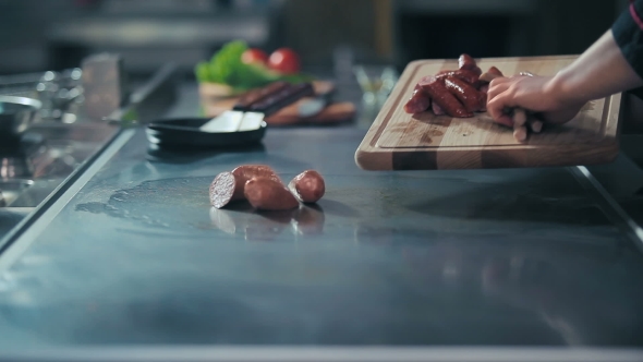 Cook Puts On The Stove Sausages alt