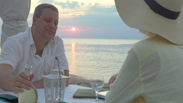 Mature Couple Enjoying Evening On The Seashore