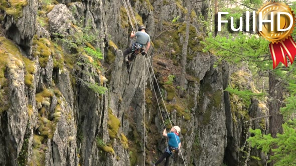 Two Climbers Descend Wild Cliff