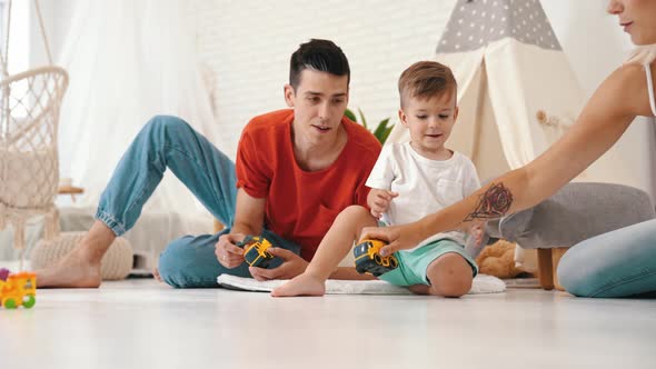 Cute Little Boy Having a Great Time with Parents at Home