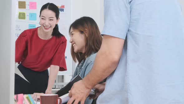 Group of asian young creative happy people casual dress entrepreneur on a presentation