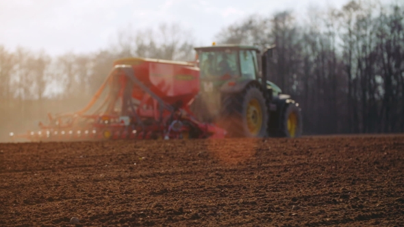 Agricultural Tractor Sowing And Cultivating Field