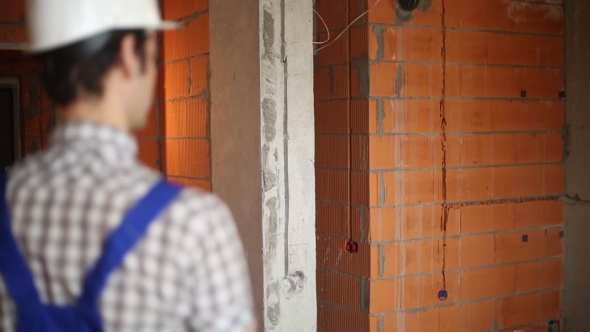Builder In Unfinished Room