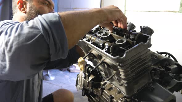 Professional Mechanic Repairing Motor From Some Vehicle