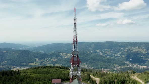 Aerial view of gsm tower transmitter on Skrzyczne Hill in Silesian Beskid and Żywieckie lake the bac