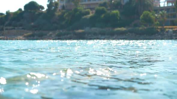 Picturesque Blue Lagoon Waves in Sunrays Rolling in Slow Motion