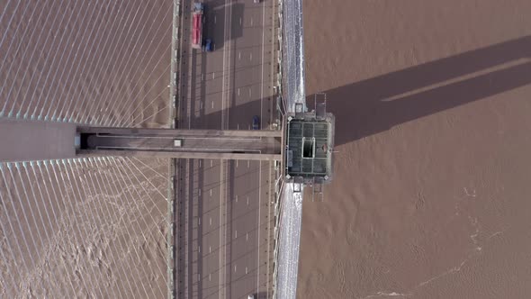 Cars and Lorries Driving Across a Cable Stayed Bridge Aerial View
