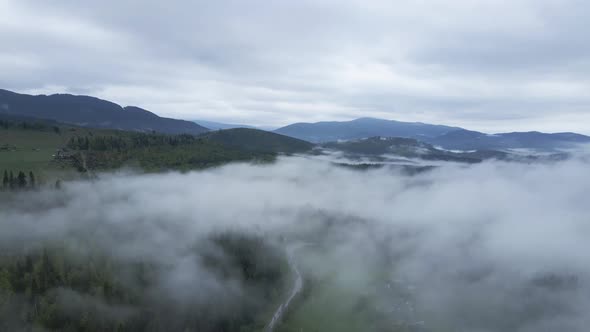 Ukraine, Carpathians: Fog in the Mountains. Aerial.