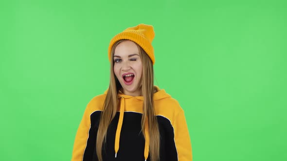 Portrait of Modern Girl in Yellow Hat Is Making Sign Ok