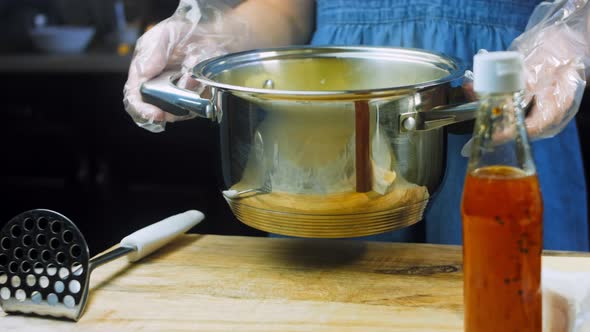 The Cook Brings the Bowl of Boiled Potatoes